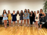 Alpha Xi Delta group photo holding the awards they won. 